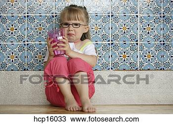 Stock Photo - sad young girl 
drinking glass 
of water. fotosearch 
- search stock 
photos, pictures, 
images, and photo 
clipart