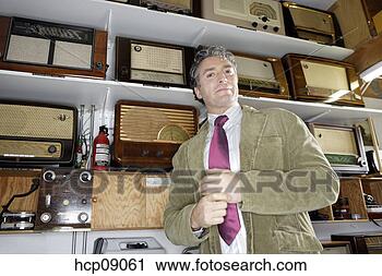 Stock Photography - salesman standing 
in front of inventory. 
fotosearch - search 
stock photos, 
pictures, images, 
and photo clipart