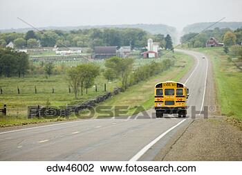 Stock Photo - school bus driving 
on rural road. 
fotosearch - search 
stock photos, 
pictures, images, 
and photo clipart
