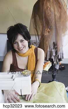 Stock Photo - seamstress using 
sewing machine. 
fotosearch - search 
stock photos, 
pictures, images, 
and photo clipart