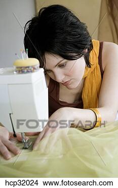 Stock Photo - seamstress using 
sewing machine. 
fotosearch - search 
stock photos, 
pictures, images, 
and photo clipart