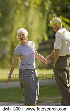 Stock Photography - senior couple 
holding hands 
walking, boston, 
massachusetts. 
fotosearch - search 
stock photos, 
pictures, images, 
and photo clipart
