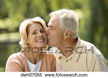 Stock Image - senior man kissing 
wife. fotosearch 
- search stock 
photos, pictures, 
images, and photo 
clipart