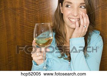 Stock Image - shy woman drinking 
white wine. fotosearch 
- search stock 
photos, pictures, 
images, and photo 
clipart