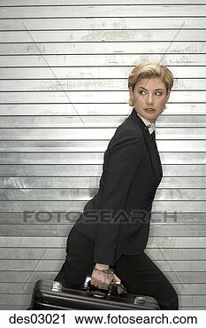 Stock Photography - sneaky businesswoman 
carrying briefcase. 
fotosearch - search 
stock photos, 
pictures, images, 
and photo clipart