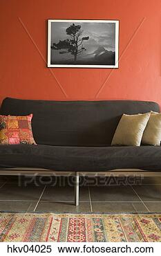 Stock Image - sofa and orange 
wall in living 
room. fotosearch 
- search stock 
photos, pictures, 
images, and photo 
clipart
