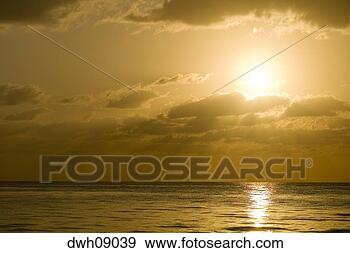 Stock Photograph - sunset over water. 
fotosearch - search 
stock photos, 
pictures, images, 
and photo clipart