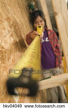 Stock Photograph - surface level 
view of teenage 
girl with tape 
measure. fotosearch 
- search stock 
photos, pictures, 
images, and photo 
clipart