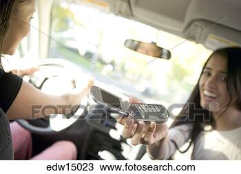 Stock Photo - teenage girl holding 
out cell phone. 
fotosearch - search 
stock photos, 
pictures, images, 
and photo clipart
