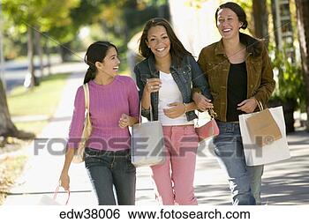 Stock Photo - teenage girls 
walking with shopping 
bags. fotosearch 
- search stock 
photos, pictures, 
images, and photo 
clipart