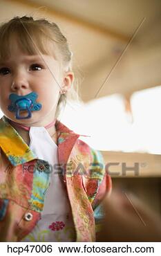 Stock Photo - toddler girl sucking 
on a pacifier. 
fotosearch - search 
stock photos, 
pictures, images, 
and photo clipart