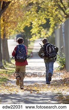 Stock Photography - two boys running 
down sidewalk. 
fotosearch - search 
stock photos, 
pictures, images, 
and photo clipart