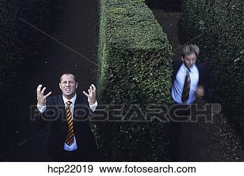 Stock Photograph - two businessmen 
lost in hedge 
maze. fotosearch 
- search stock 
photos, pictures, 
images, and photo 
clipart