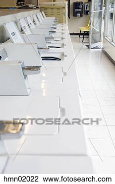 Stock Photo - washing machines 
in laundromat. 
fotosearch - search 
stock photos, 
pictures, images, 
and photo clipart