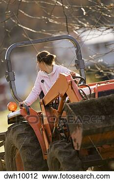 Stock Photo - woman driving 
tractor. fotosearch 
- search stock 
photos, pictures, 
images, and photo 
clipart