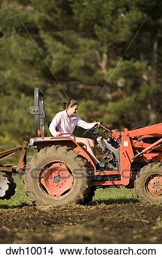 Stock Photo - woman driving 
tractor. fotosearch 
- search stock 
photos, pictures, 
images, and photo 
clipart