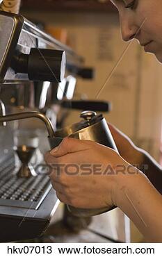Stock Photo - woman filling 
metal pitcher. 
fotosearch - search 
stock photos, 
pictures, images, 
and photo clipart