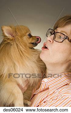Stock Photo - woman holding 
her dog. fotosearch 
- search stock 
photos, pictures, 
images, and photo 
clipart