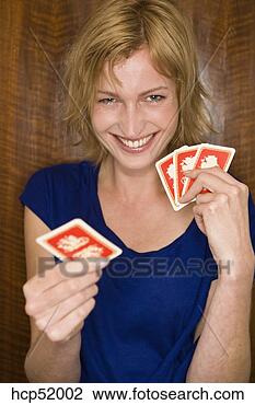 Stock Photo - woman holding 
playing cards. 
fotosearch - search 
stock photos, 
pictures, images, 
and photo clipart