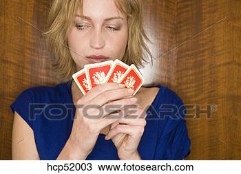 Stock Photo - woman holding 
playing cards. 
fotosearch - search 
stock photos, 
pictures, images, 
and photo clipart