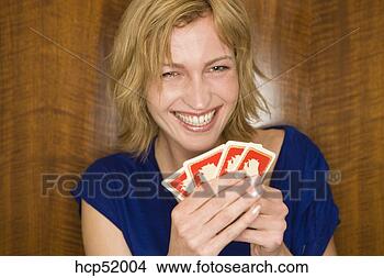 Stock Photo - woman holding 
playing cards. 
fotosearch - search 
stock photos, 
pictures, images, 
and photo clipart