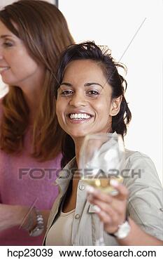 Stock Photograph - woman of indian 
ethnicity drinking 
white wine. fotosearch 
- search stock 
photos, pictures, 
images, and photo 
clipart