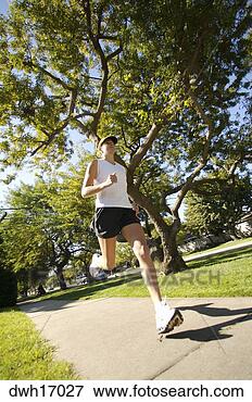 Picture - woman jogging 
on suburb sidewalk. 
fotosearch - search 
stock photos, 
pictures, images, 
and photo clipart