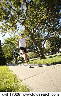 Stock Photo - woman jogging 
on suburb sidewalk. 
fotosearch - search 
stock photos, 
pictures, images, 
and photo clipart