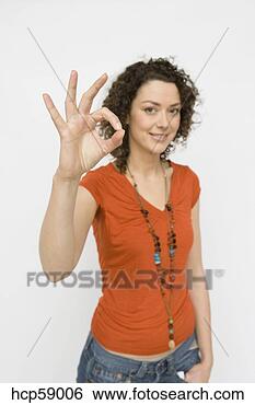 Stock Photo - woman making the 
ok symbol with 
fingers. fotosearch 
- search stock 
photos, pictures, 
images, and photo 
clipart