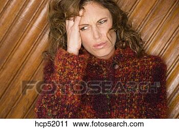 Stock Photography - woman rubbing 
her head. fotosearch 
- search stock 
photos, pictures, 
images, and photo 
clipart