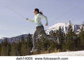 Stock Image - woman running 
on snow. fotosearch 
- search stock 
photos, pictures, 
images, and photo 
clipart