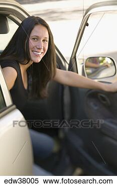 Stock Image - woman stepping 
out of car. fotosearch 
- search stock 
photos, pictures, 
images, and photo 
clipart
