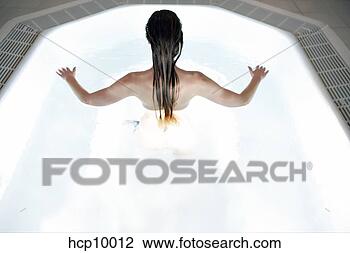 Stock Photo - woman submerged 
in hot tub. fotosearch 
- search stock 
photos, pictures, 
images, and photo 
clipart