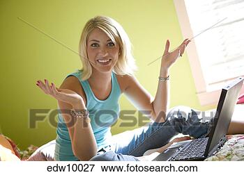 Picture - woman using laptop 
without hands. 
fotosearch - search 
stock photos, 
pictures, images, 
and photo clipart