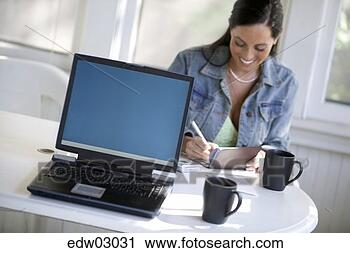 Stock Photography - woman writing 
a check. fotosearch 
- search stock 
photos, pictures, 
images, and photo 
clipart