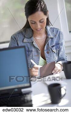Stock Photo - woman writing 
a check. fotosearch 
- search stock 
photos, pictures, 
images, and photo 
clipart
