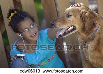 Stock Photo - young african 
girl listening 
to mp3 player 
and petting dog. 
fotosearch - search 
stock photos, 
pictures, images, 
and photo clipart