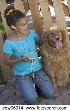 Stock Photo - young african 
girl listening 
to mp3 player 
and petting dog. 
fotosearch - search 
stock photos, 
pictures, images, 
and photo clipart