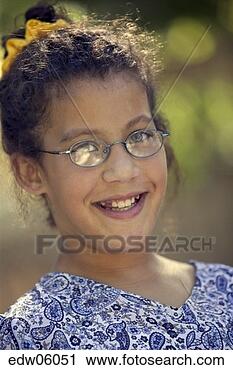 Stock Photography - young african 
girl with eyeglasses 
smiling. fotosearch 
- search stock 
photos, pictures, 
images, and photo 
clipart