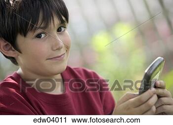 Stock Photography - young boy playing 
video game. fotosearch 
- search stock 
photos, pictures, 
images, and photo 
clipart