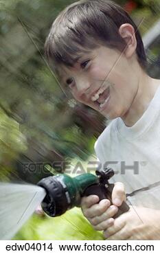 Stock Photo - young boy spraying 
hose. fotosearch 
- search stock 
photos, pictures, 
images, and photo 
clipart