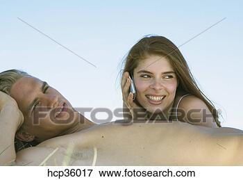 Picture - young couple laying 
in shade. fotosearch 
- search stock 
photos, pictures, 
images, and photo 
clipart