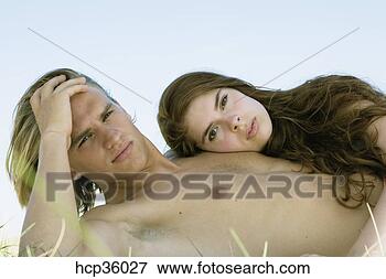 Picture - young couple laying 
in shade. fotosearch 
- search stock 
photos, pictures, 
images, and photo 
clipart