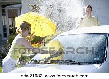 Stock Photo - young couple playing 
and washing car. 
fotosearch - search 
stock photos, 
pictures, images, 
and photo clipart