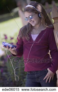 Stock Image - young girl listening 
to cd player. 
fotosearch - search 
stock photos, 
pictures, images, 
and photo clipart