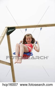 Picture - young girl swinging. 
fotosearch - search 
stock photos, 
pictures, images, 
and photo clipart