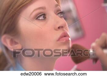 Stock Photo - young woman applying 
make-up. fotosearch 
- search stock 
photos, pictures, 
images, and photo 
clipart