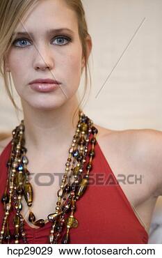 Stock Photograph - young woman with 
fixed gaze wearing 
beaded necklaces. 
fotosearch - search 
stock photos, 
pictures, images, 
and photo clipart