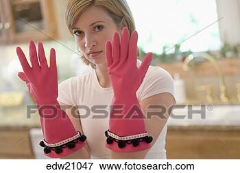 Picture - young woman wearing 
dishwashing gloves. 
fotosearch - search 
stock photos, 
pictures, images, 
and photo clipart