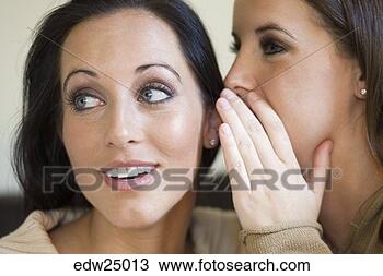 Stock Photo - young women gossipping. 
fotosearch - search 
stock photos, 
pictures, images, 
and photo clipart